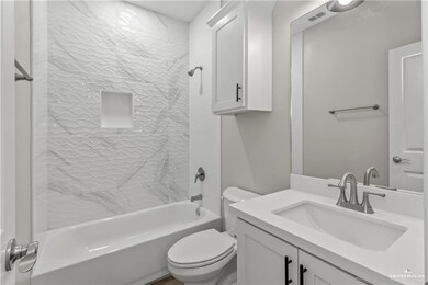 Full bath with toilet, vanity, and  shower combination