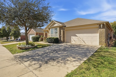 Ranch-style home featuring driveway, an attached garage, brick siding, and roof with shingles