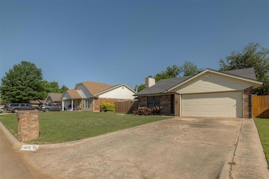 Ranch-style home with brick siding, driveway, an a