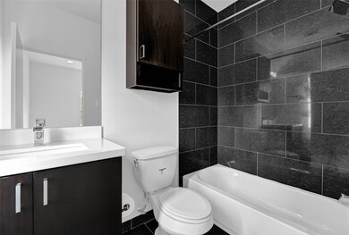 Secondary bathroom with a single sink and shower/t