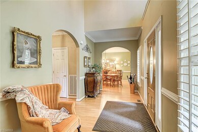 Foyer entry leads arched entryway to Great Room and Dining Room.