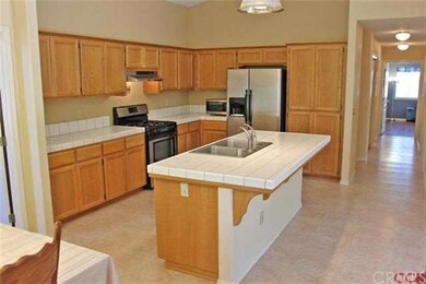 Large kitchen with sink in the center island so yo