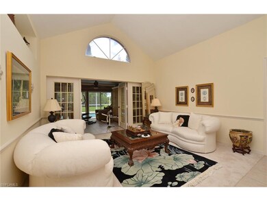 Living room opens to Florida Room through French d