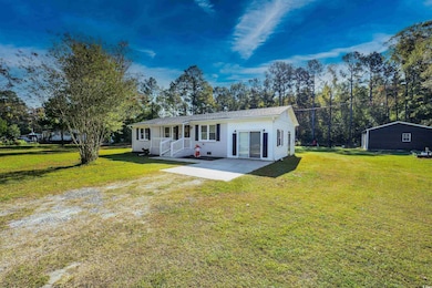 View of front of home featuring a patio and a fron