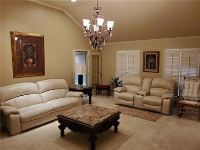 Living room with unique ceiling and lots of window
