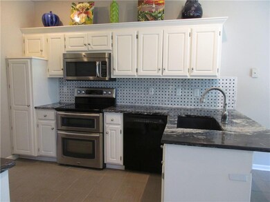 Updated Kitchen with SS Glass Top Range with Doubl