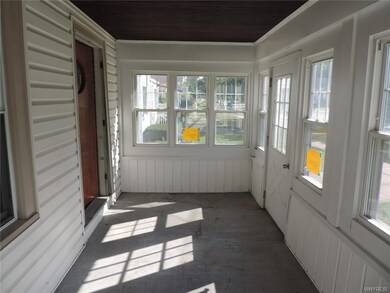 The front enclosed porch.