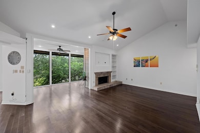 Unfurnished living room with ceiling fan, lofted 