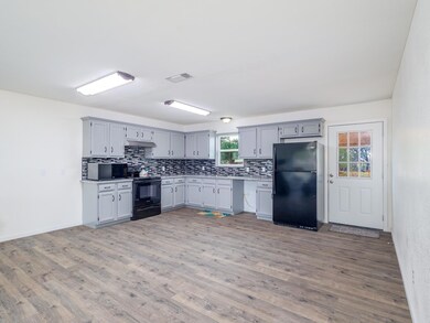 Kitchen featuring wood-type flooring, a healthy am