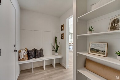 Mudroom featuring light wood finished floors