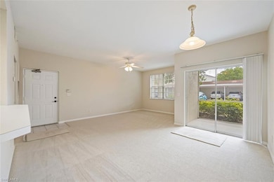 Spare room with light carpet and ceiling fan