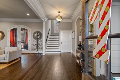 Stunning entry with hardwoods, gorgeous millwork a