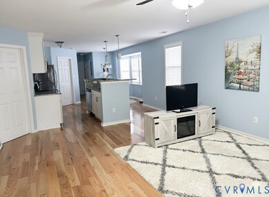 Living area with open plan and hardwoods
