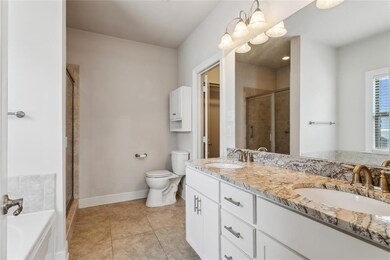 Primary bath with dueling sinks and granite counte