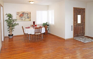 Entry and dining room with hardwood floors