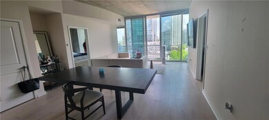 Dining space with light wood-style floors, baseboa