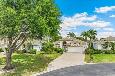 View of front of property featuring driveway, a ti