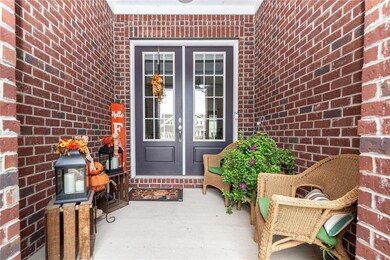 Welcome Home! How inviting is this covered porch? Perfect place to sit and enjoy morning coffee.