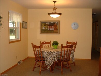 Large Dining area attached to the kitchen.  Sunny 