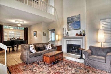 The living room is open to the second floor and an