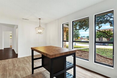 Three large windows in the kitchen and breakfast a