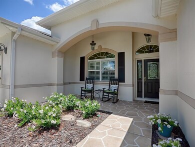PAINTED WALKWAY AND INVITING FRONT PORCH WITH LEAD