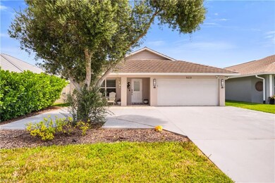 Ranch-style house featuring stucco siding, a garage, driveway, and a tile roof