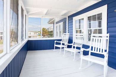 Sunroom with beamed ceiling