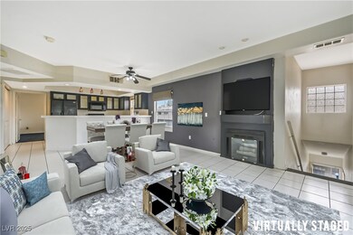 Virtually Staged. Tiled living room featuring ceil