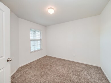 Large study/office with French doors over looks the front porch.