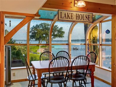 Glassed in eating area off of the Kitchen with Lak
