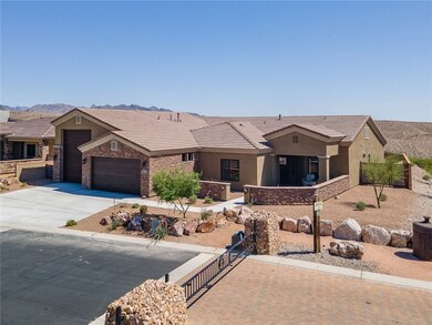 Ranch-style house featuring concrete driveway, a g