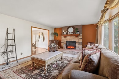 Living area featuring a fireplace and​​‌​​​​‌​​‌‌​​​‌​​‌‌​​‌‌​‌​​​‌‌​​‌​​​​​‌ carpet