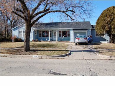 This adorable home is on a corner lot and has an e