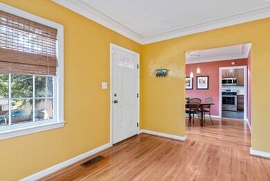 Living room with view of dining room & kitchen