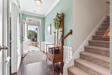 Entrance foyer with visible vents, ornamental mold