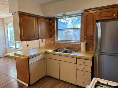 The Kitchen overlooks the backyard
