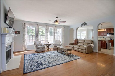 Large family room with gas fireplace overlooks the