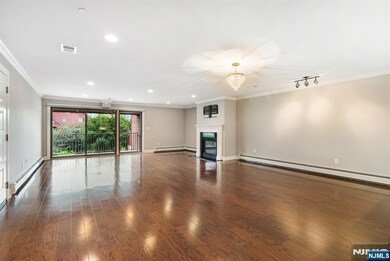 Living Room with Balcony & Fireplace