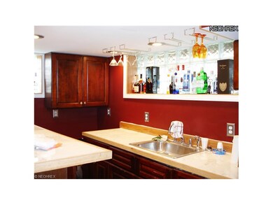 the wet bar is new and includes marble tops and a 
