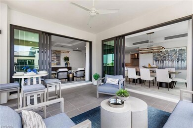 Living room with ceiling fan and tile patterned fl