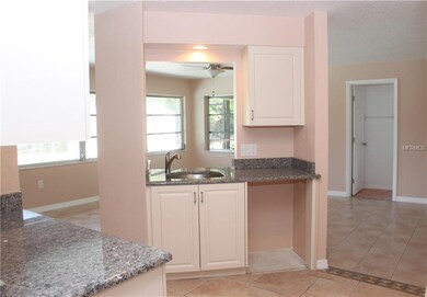 Kitchen overlooking lanai and pool - GRANITE!