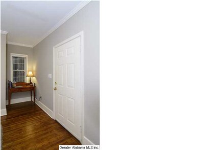 This unit has beautiful hardwoods, crown molding, 