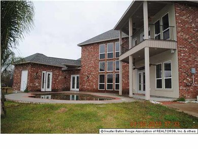rear elevation with pool house and pool