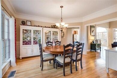 Large formal dining room with chair rail & crown m