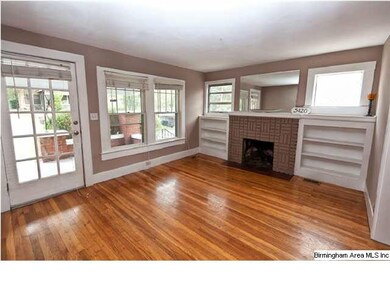 Living Room with Hardwood floors, fireplace and bu