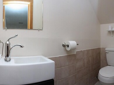 Bathroom. Right off the Family room is the newly renovated powder room.  Very cool!