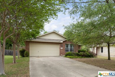 Front of the home with beautiful trees.