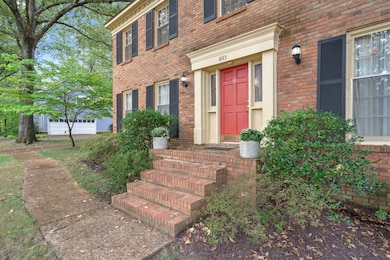Doorway to property with a garage