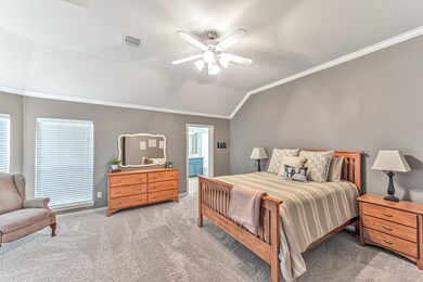 The owners retreat is large enough to handle big furniture and boasts a sitting area in front of large windows that allow lots of natural light.